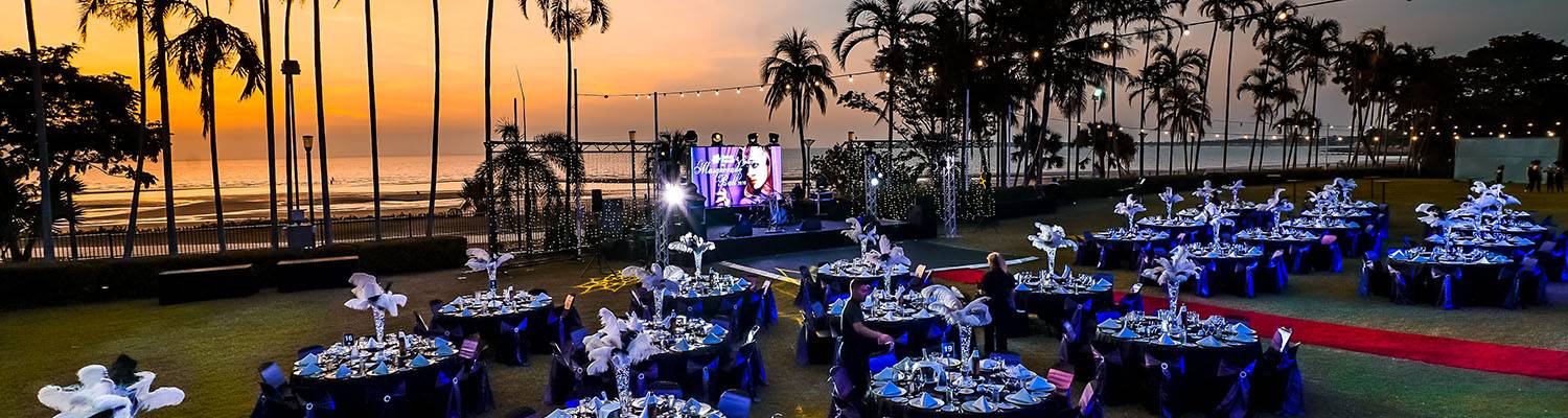Outdoor event set-up with tables and stage | Beachside Events | Darwin, Australia