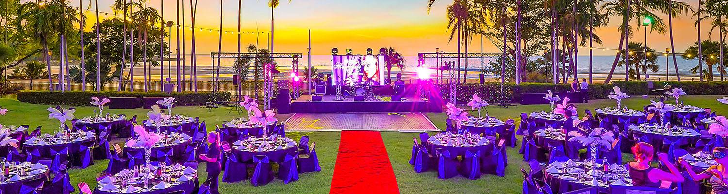 Outdoor event set-up with tables and stage | Oceanside Events | Darwin, Australia