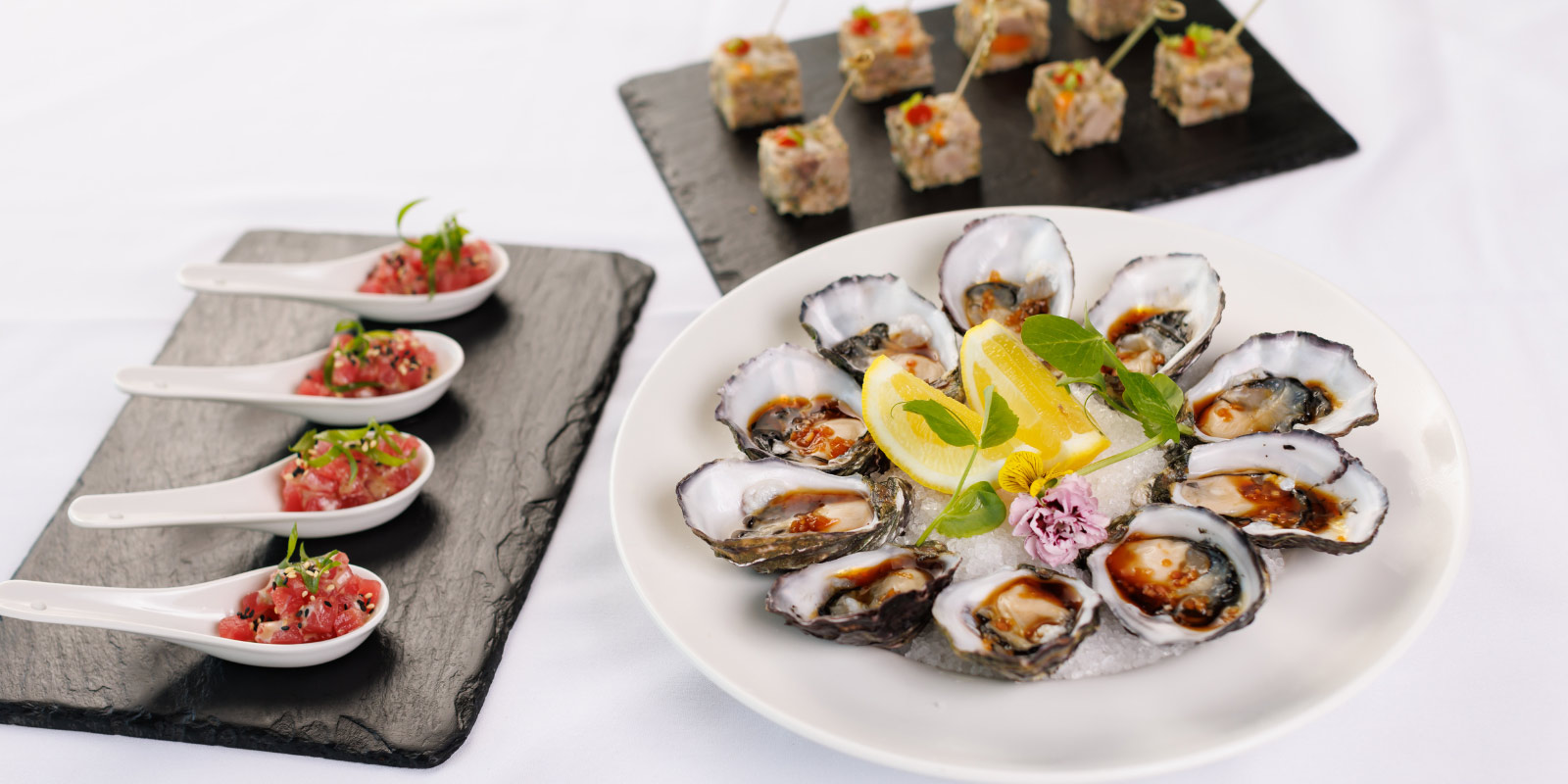 Assortment of appetizers featuring sea food and other delicacies.