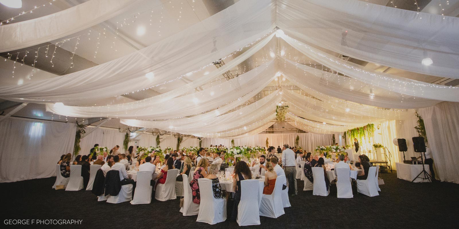 Wedding with white drapery and fine dining at Mindil Beach