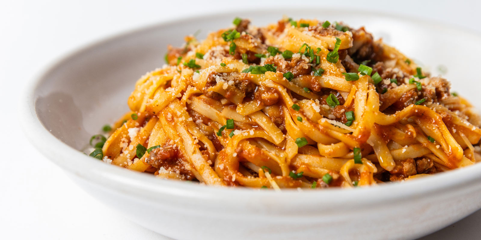 Pasta dish with meat and chives
