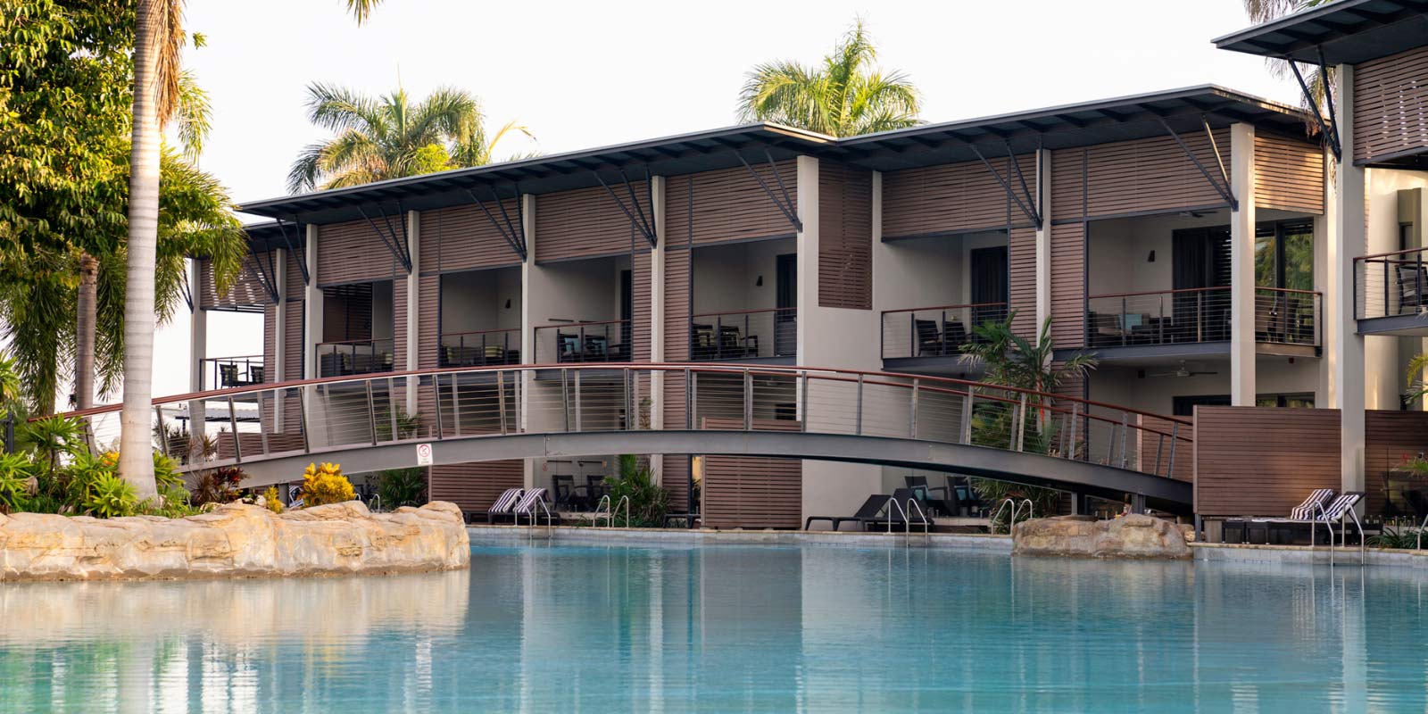 Exterior shot featuring the pool and balconies of villas.