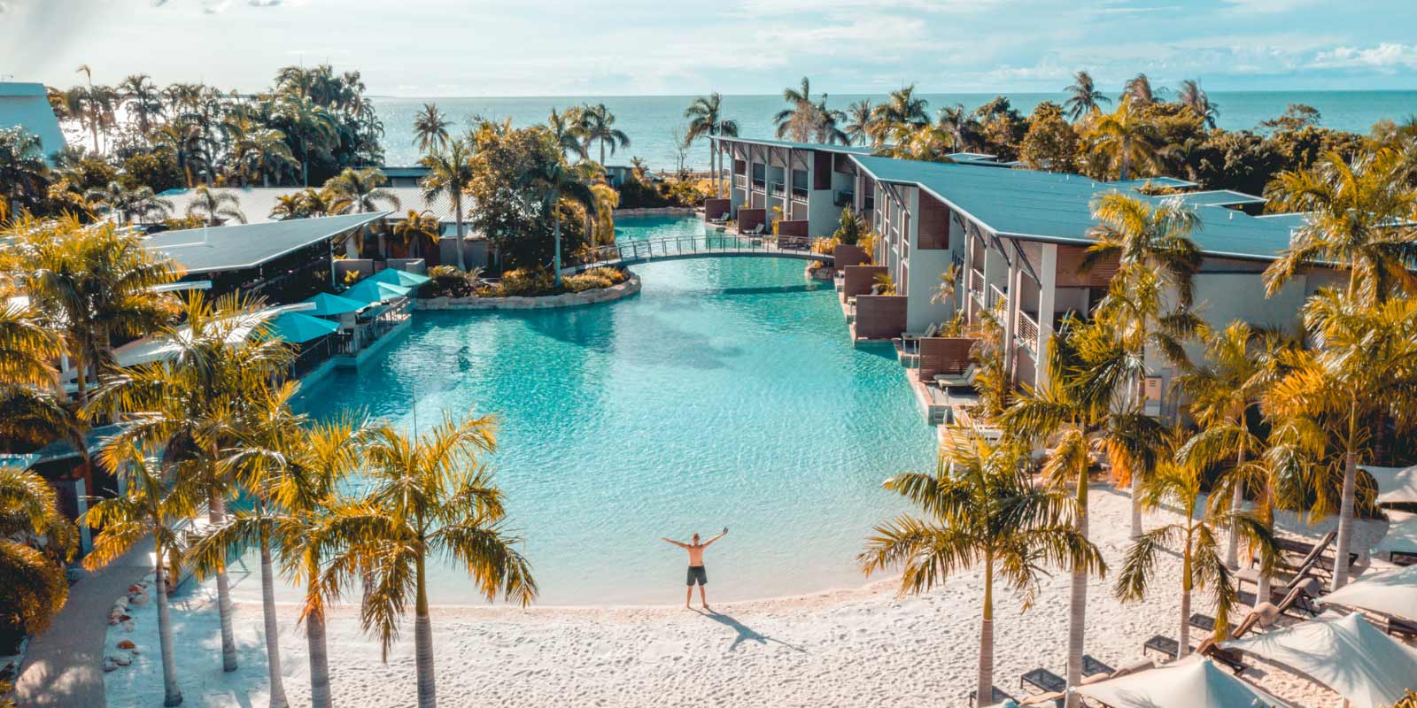 Exterior shot of the resort area featuring the pool and beach area.