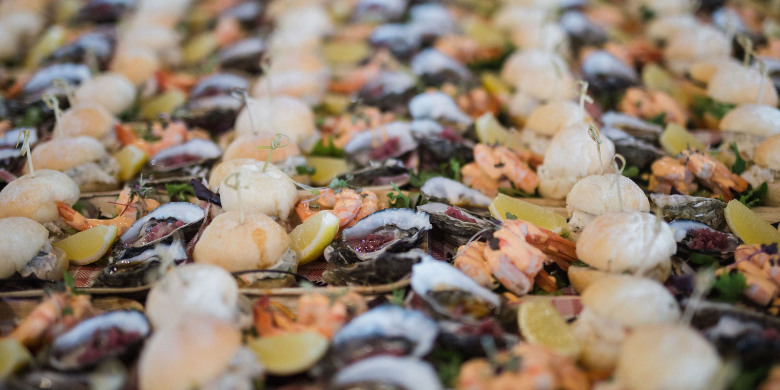 Assortment of sea food lined up in neat rows.