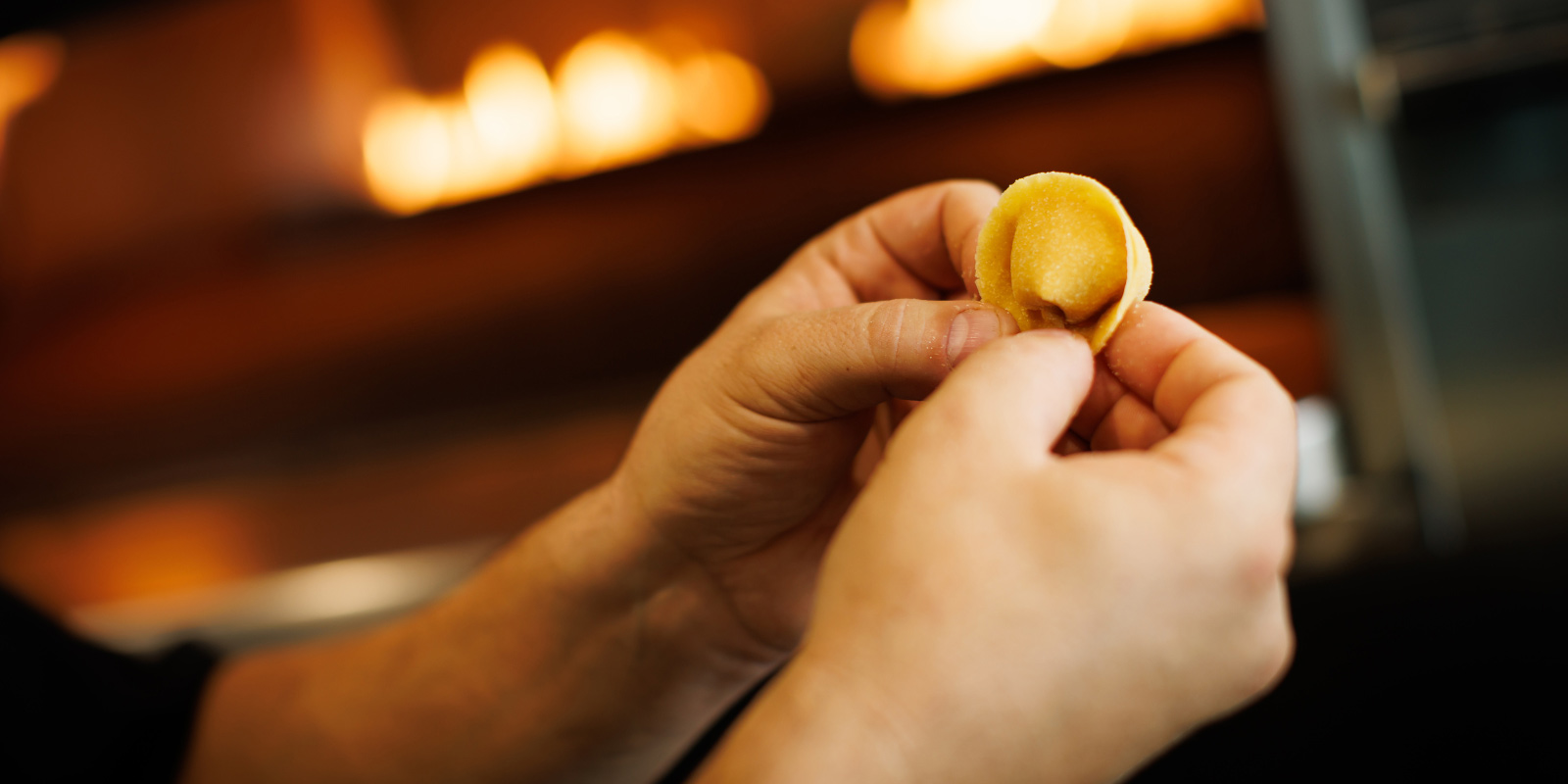 Chef folding the dough to create a noodle for dinner at il Piatto