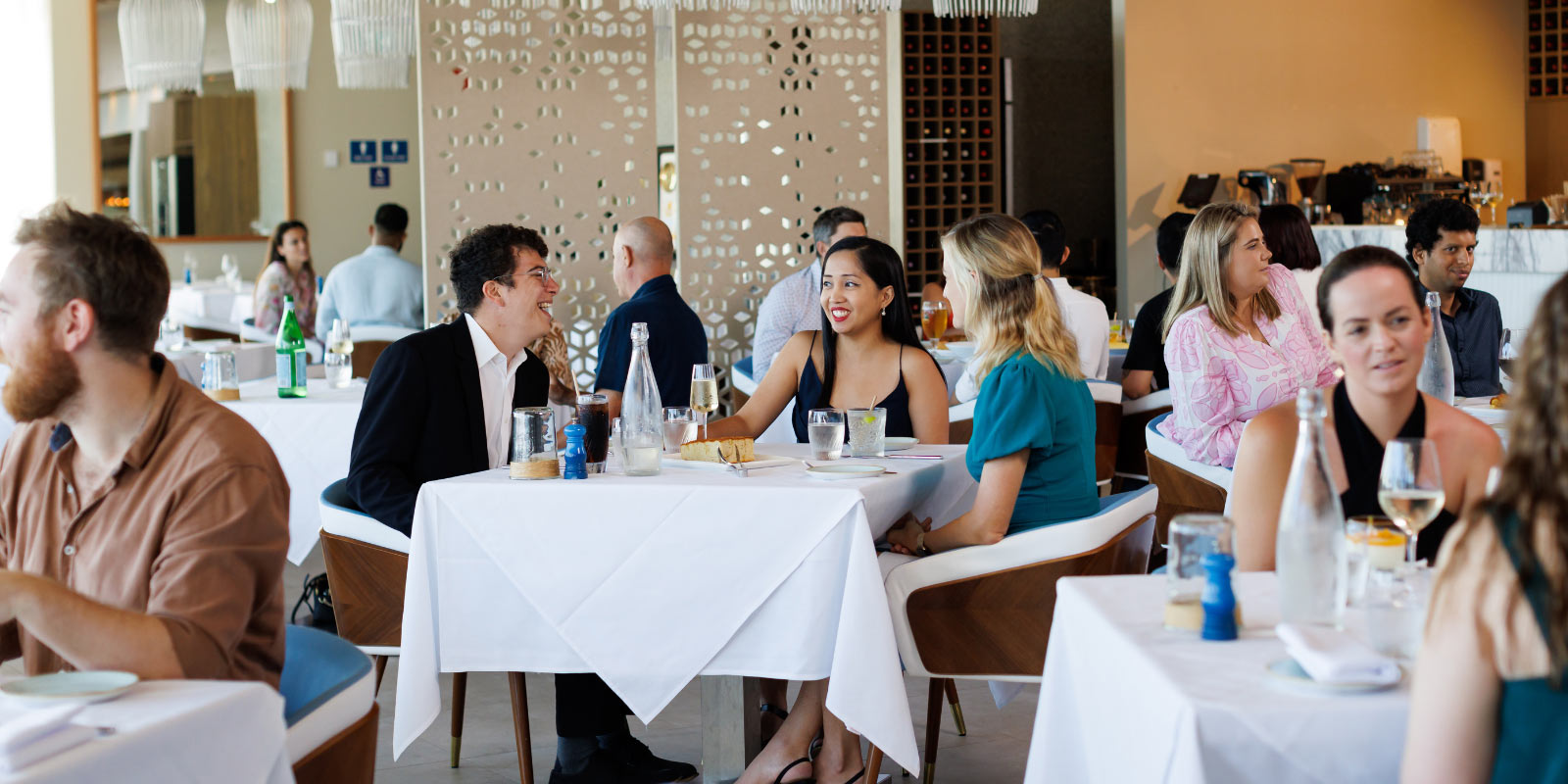 People enjoying dinner at tables at il Piatto