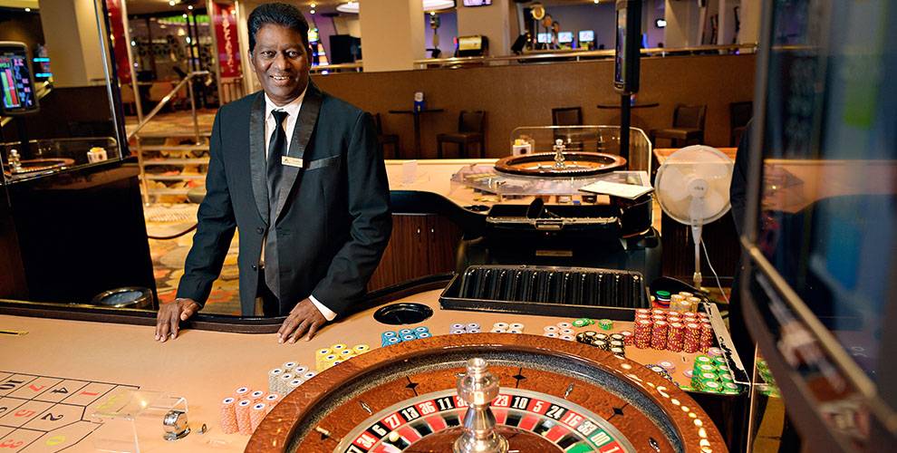 Casino Dealer with Roulette Wheel | Mindil Beach Casino & Resort